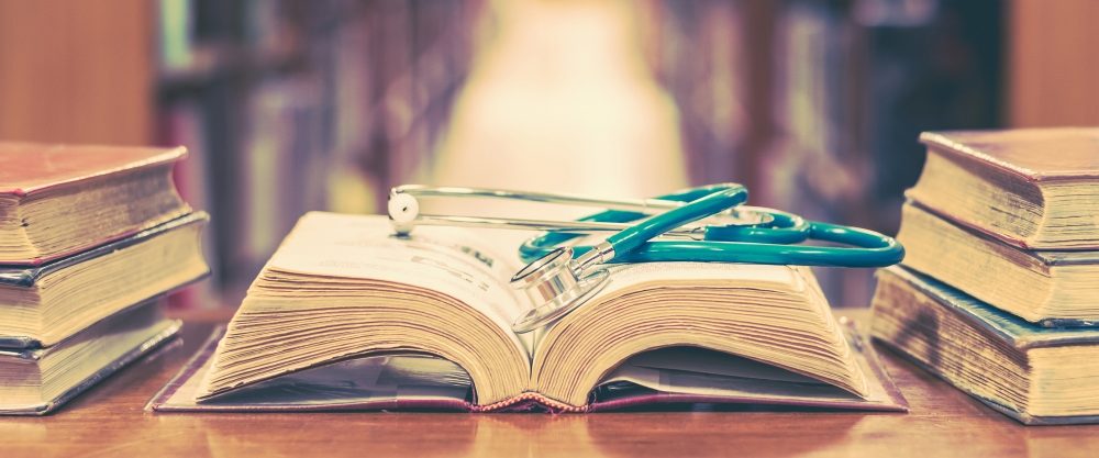 Stethoscope and books in a library